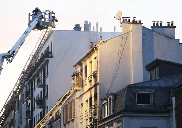 firemen stand in an aerial bucket to extinguish a fire in a building on june 6 2016 in saint denis near paris a fire broke out on june 6 2016 evening in a residential building in central saint denis causing seven wounded two seriously according to concordant sources afp photo firemen stand in an aerial bucket to extinguish a fire in a building on june 6 2016 in saint denis near paris a fire broke out on june 6 2016 evening in a residential building in central saint denis causing seven wounded two seriously according to concordant sources afp photo