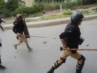 officers suspended for baton charge reinstated