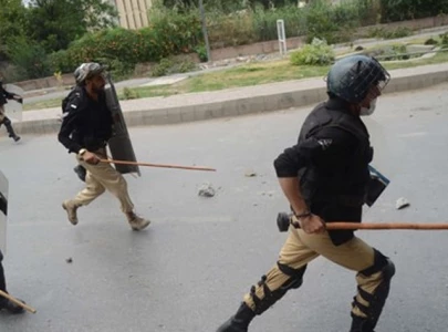 officers suspended for baton charge reinstated