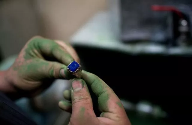 an afghan student works on a lapis lazuli ring during a jewellery class in kabul photo afp an afghan student works on a lapis lazuli ring during a jewellery class in kabul photo afp