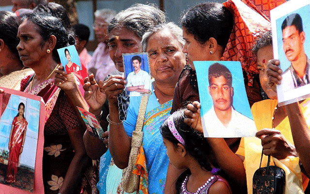 tamil protesters hold photographs of missing relatives during a 2013 demonstration in the northern sri lankan town of jaffna photo afp