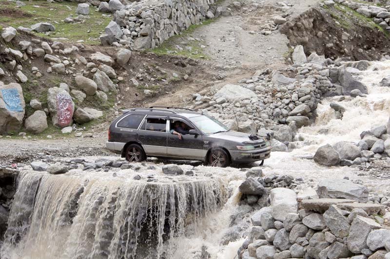 a car is stranded on the broken kalam road photo express