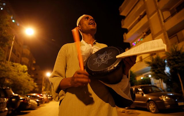 el mesaharty hussien 40 wakes up residents for their pre dawn meals during the first day of ramadan in cairo egypt june 6 photo reuters