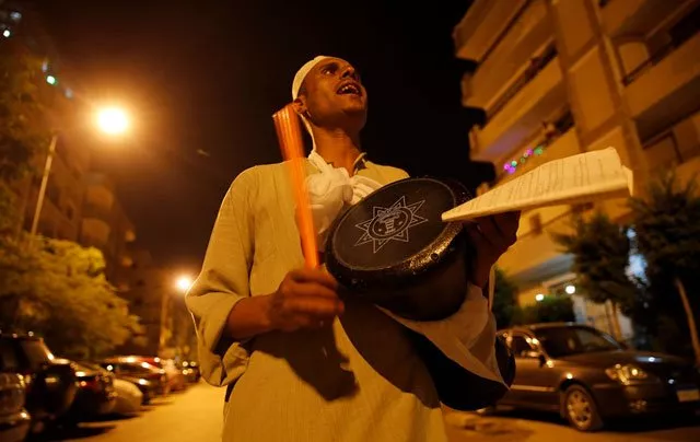 el mesaharty hussien 40 wakes up residents for their pre dawn meals during the first day of ramadan in cairo egypt june 6 photo reuters