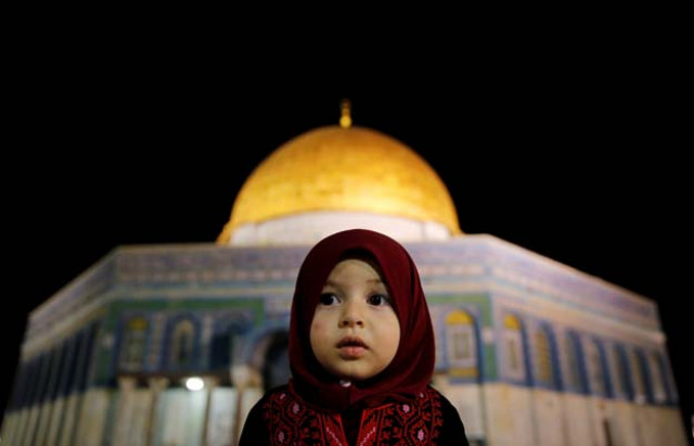 a palestinian girl prays in front of the dome of the rock at the compound known to muslims as noble sanctuary and to jews as the temple mount in jerusalem 039 s old city during the holy month of ramazan june 7 2016 photo reuters