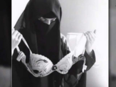offended by a veiled woman holding a bra