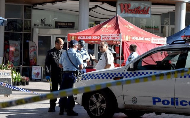 police officers secure the area close to the scene of a police shooting at the shopping arcade in hornsby area of sydney on june 9 2016 photo afp police officers secure the area close to the scene of a police shooting at the shopping arcade in hornsby area of sydney on june 9 2016 photo afp