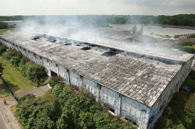 smoke rises from a building used as refugee shelter in duesseldorf western germany on june 7 2016 photo afp