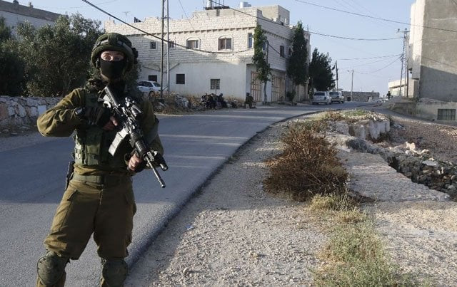 israel locked down the west bank town of yatta on june 9 as they searched for clues after two palestinian gunmen shot dead four people at a popular tel aviv nightspot photo afp israel locked down the west bank town of yatta on june 9 as they searched for clues after two palestinian gunmen shot dead four people at a popular tel aviv nightspot photo afp
