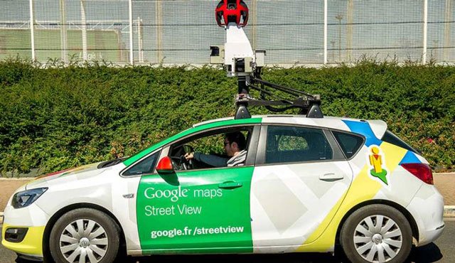 a google street view vehicle collects imagery for google maps while driving down a street in calais northern france photo afp