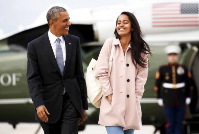 us president barack obama and his daughter malia walk from marine one to board air force one upon their departure from o 039 hare airport in chicago april 7 2016 us president barack obama and his daughter malia walk from marine one to board air force one upon their departure from o 039 hare airport in chicago april 7 2016