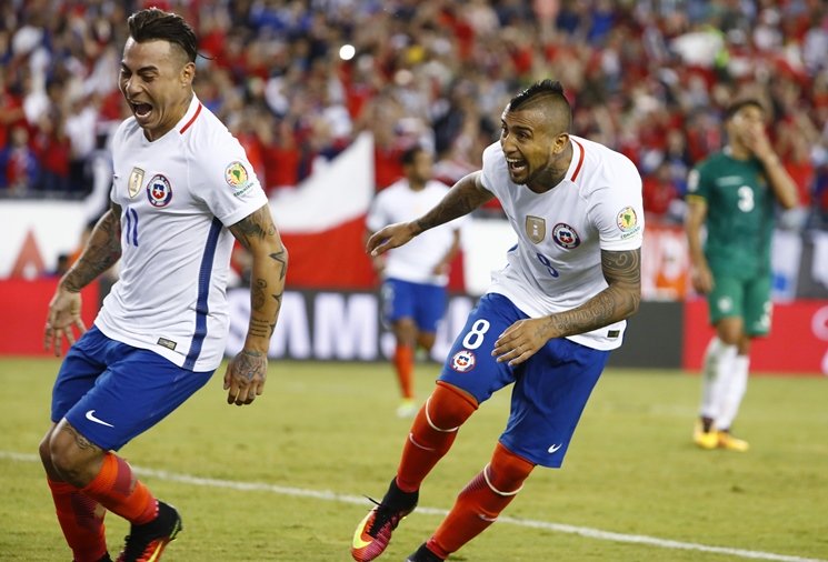 chile midfielder arturo vidal 8 celebrates his penalty kick goal in extra time with forward eduardo vargas 11 during the second half of chile 039 s 2 1 win over bolivia in the group play stage of the 2016 copa america centenario at gillette stadium on june 10 2016 photo reuters