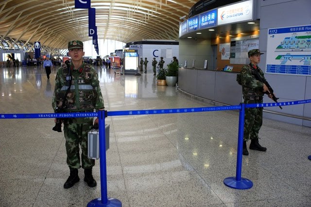 paramilitary policemen guard near the site of a blast at a terminal in shanghai 039 s pudong international airport china june 12 2016 photo reuters