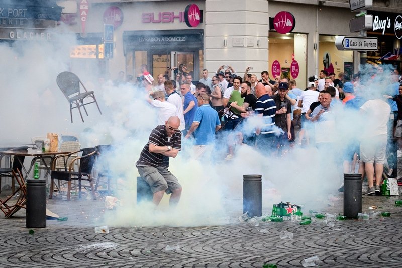 england supporters engulfed in tear gas during clashes with police in marseille france on june 10 2016 photo afp