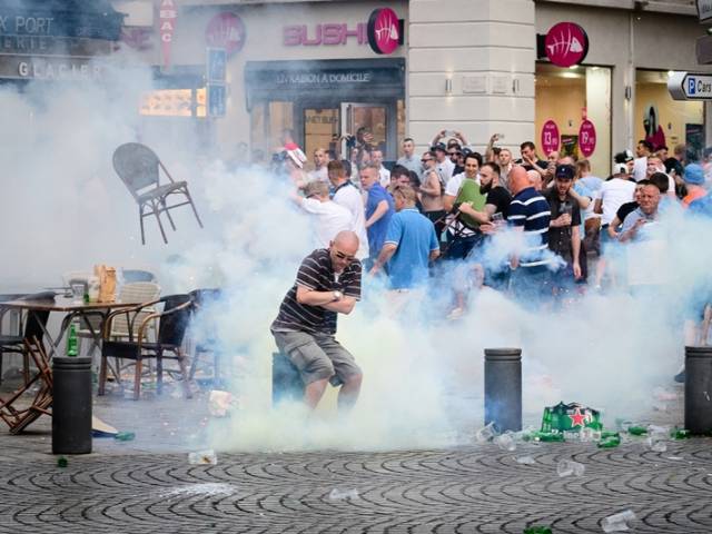 england supporters engulfed in tear gas during clashes with police in marseille france on june 10 2016 photo afp
