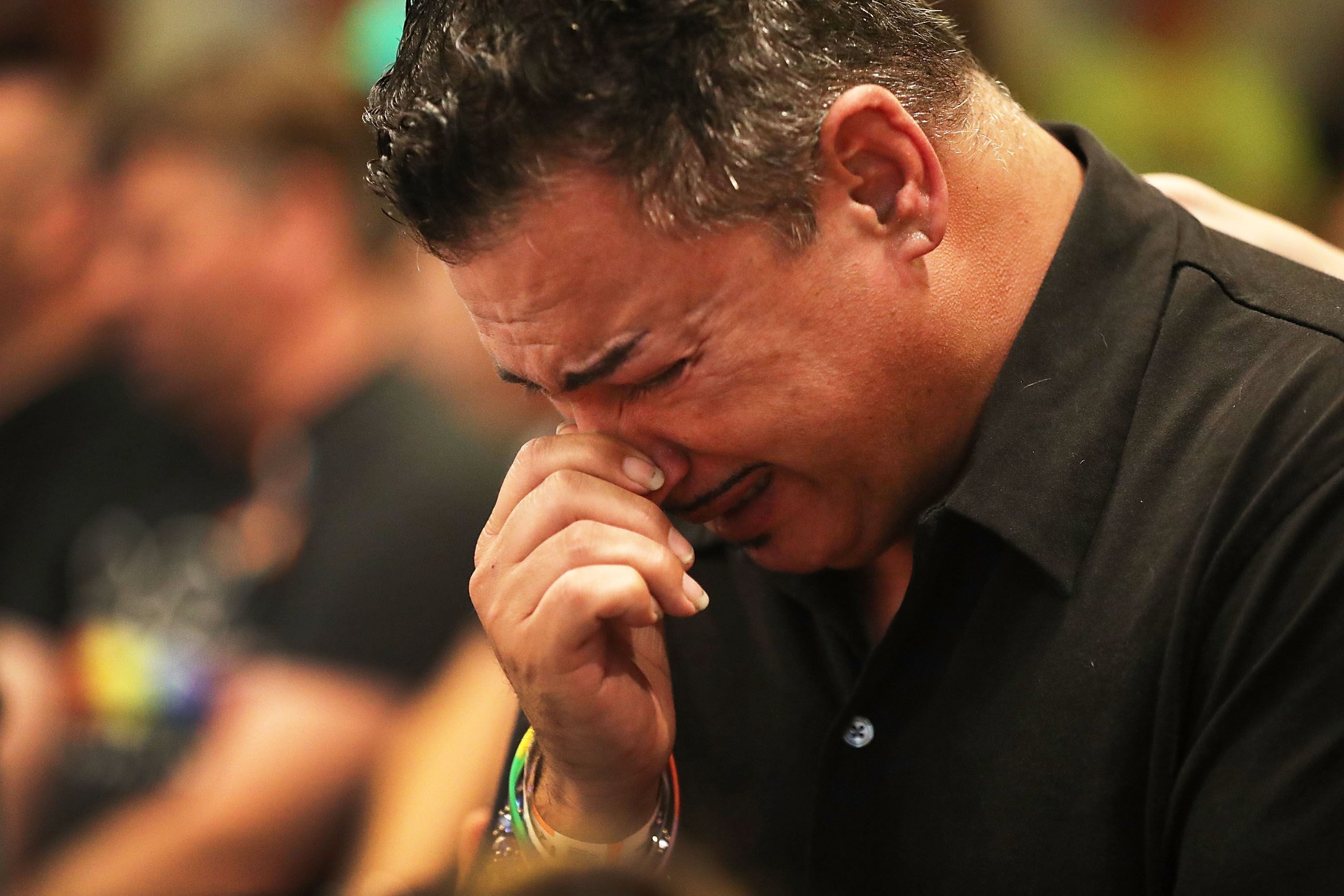 orlando man who was injured in the mass shooting at the pulse nightclub cries as he attends a memorial service at the joy mcc church for the victims of the terror attack where omar mateen allegedly killed more than 50 people on june 12 2016 in orlando florida photo afp