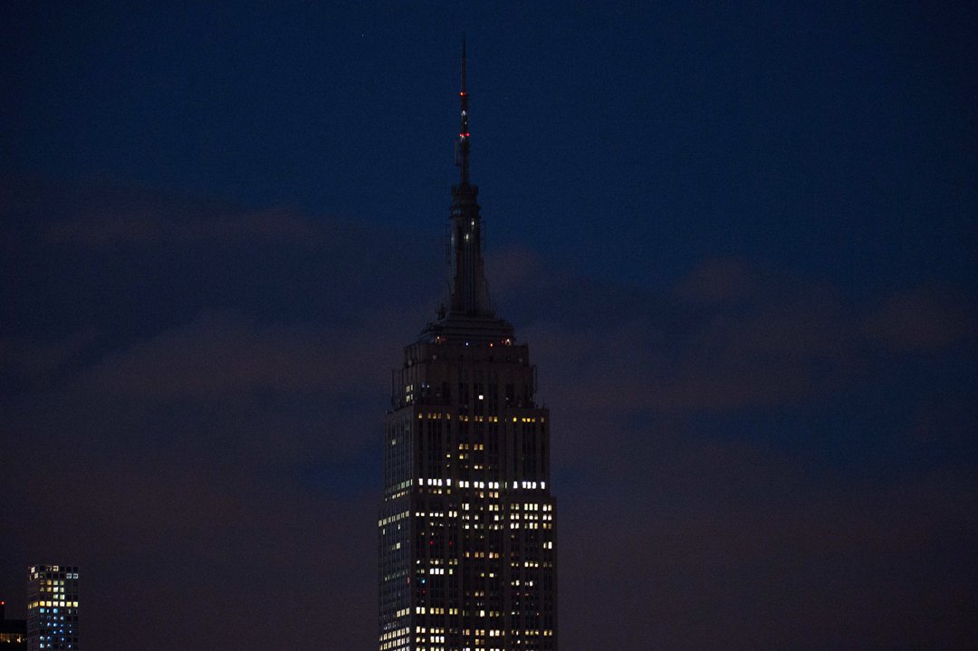 the empire state building goes dark in new york on june 12 2016 in reaction to the mass shooting at a gay nightclub in orlando florida fifty people died when a gunman allegedly inspired by the islamic state group opened fire inside a gay nightclub in florida in the worst terror attack on us soil since september 11 2001 afp photo