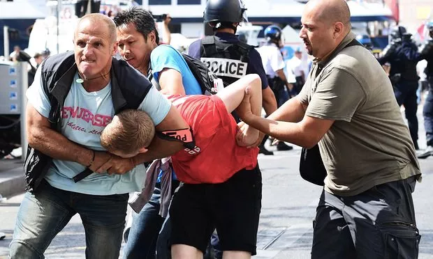 an england fan is detained by police following clashes between england fans and police in marseille photo afp an england fan is detained by police following clashes between england fans and police in marseille photo afp