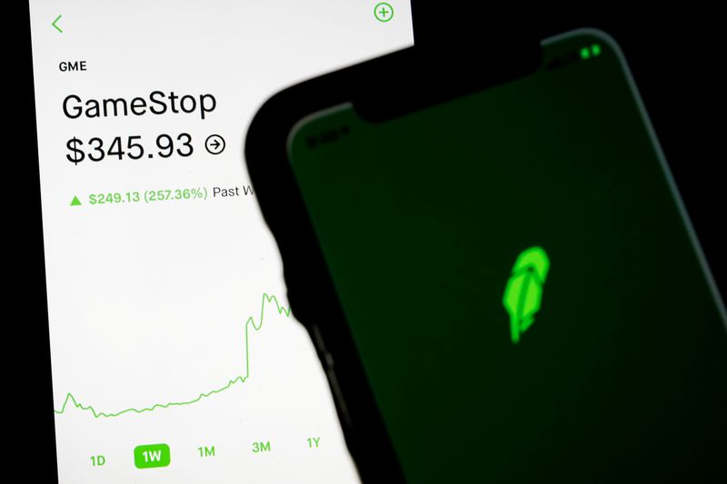 trading information for gamestop is displayed on the robinhood app as another screen displays the robinhood logo photo reuters