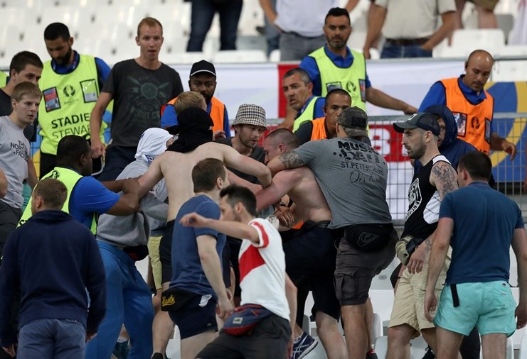 groups of supporters clash fight at the end of the euro 2016 group b football match between england and russia at the stade velodrome in marseille on june 11 2016 photo afp