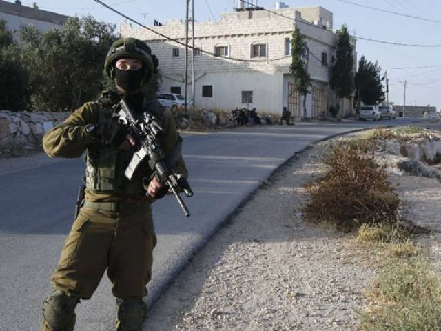 israel locked down the west bank town of yatta on june 9 as they searched for clues after two palestinian gunmen shot dead four people at a popular tel aviv nightspot photo afp israel locked down the west bank town of yatta on june 9 as they searched for clues after two palestinian gunmen shot dead four people at a popular tel aviv nightspot photo afp