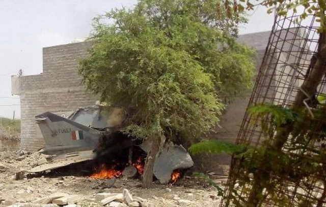 two houses were also damaged as the aircraft on its routine training mission crashed in jodhpur photo courtesy ani asian news international two houses were also damaged as the aircraft on its routine training mission crashed in jodhpur photo courtesy ani asian news international