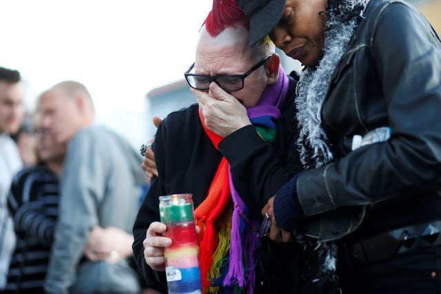 trashina cann l and vixen noir both of san francisco attend a candlelight vigil for the victims of the orlando attack against a gay night club held in san francisco california us june 12 2016 photo reuters