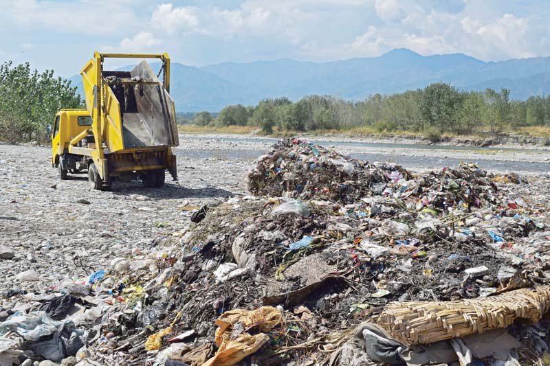 waste dumped along swat river photo express