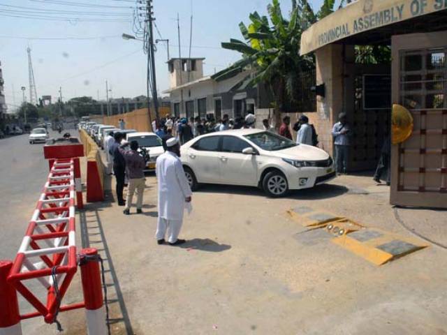 people form a long que outside the sindh assembly building waiting to be cleared for entrace by the assembly 039 s security staff photo express