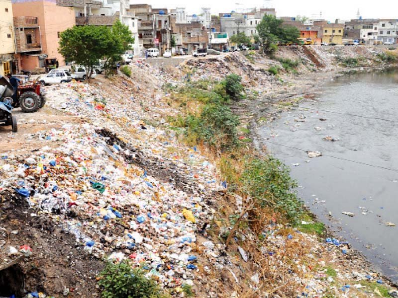 large quantity of waste can be seen dumped at the banks of nullah leh in dhoke chiraghdin area photo agha mehroz express