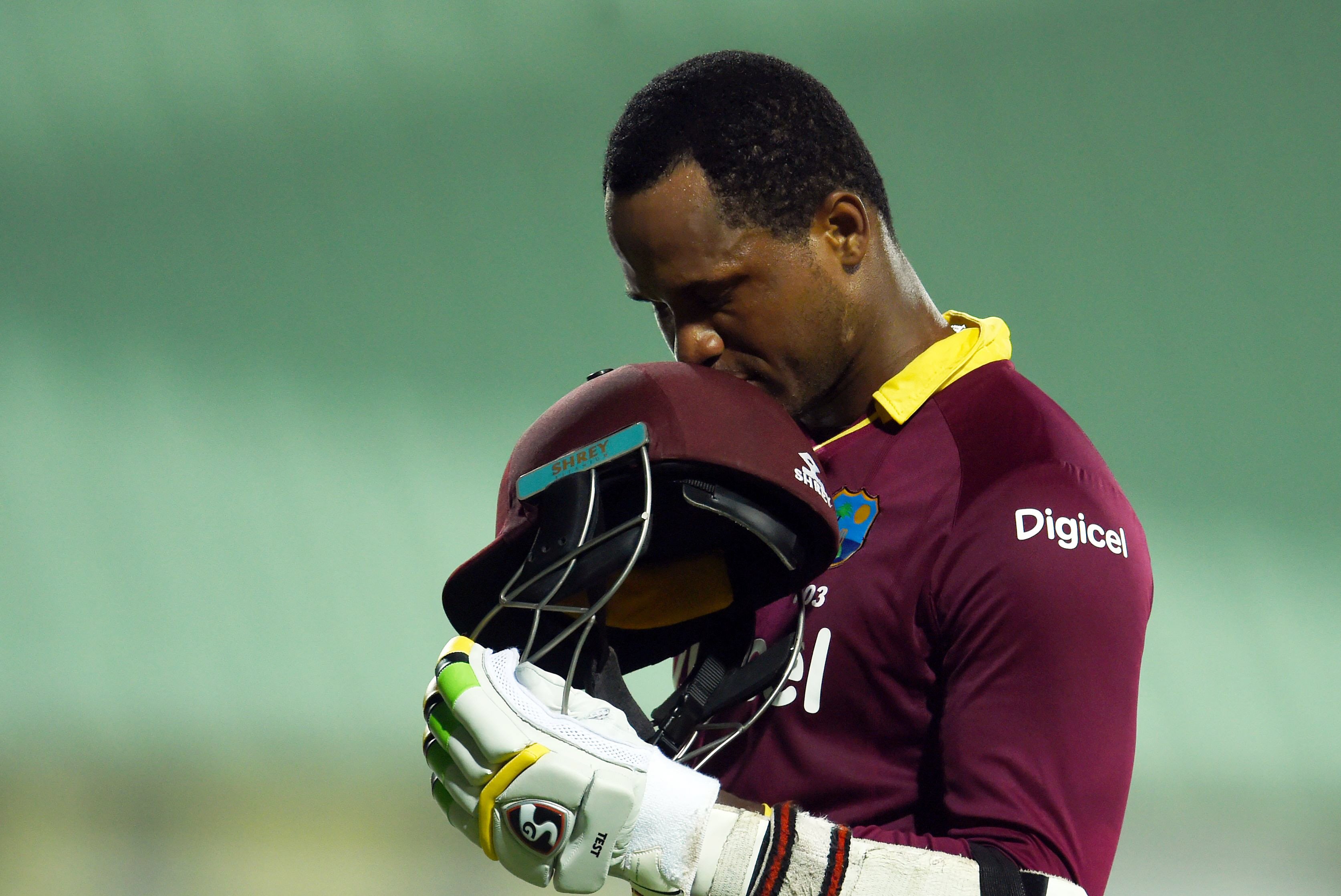 marlon samuels leaves the field after being dismissed by matthew wade at the warner park stadium in basseterre saint kitts on june 13 2016 photo afp