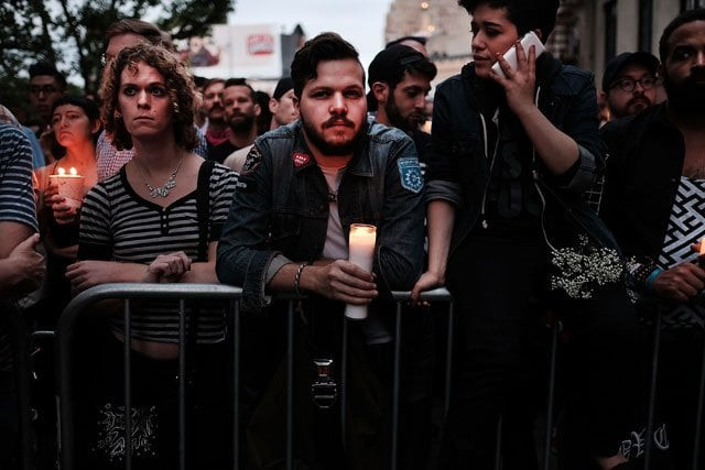hundreds of people listen to speakers at a memorial gathering for those killed in orlando in front of the iconic new york city gay and lesbian bar the stonewall inn on june 13 2016 in new york city photo afp hundreds of people listen to speakers at a memorial gathering for those killed in orlando in front of the iconic new york city gay and lesbian bar the stonewall inn on june 13 2016 in new york city photo afp