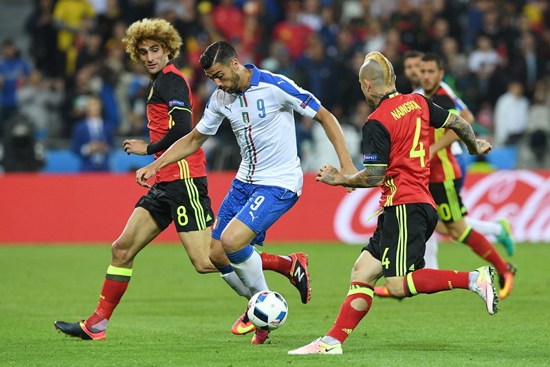 pelle vies with fellaini and nianggolan at parc olympique lyonnais stadium in lyon on june 13 2016 photo afp