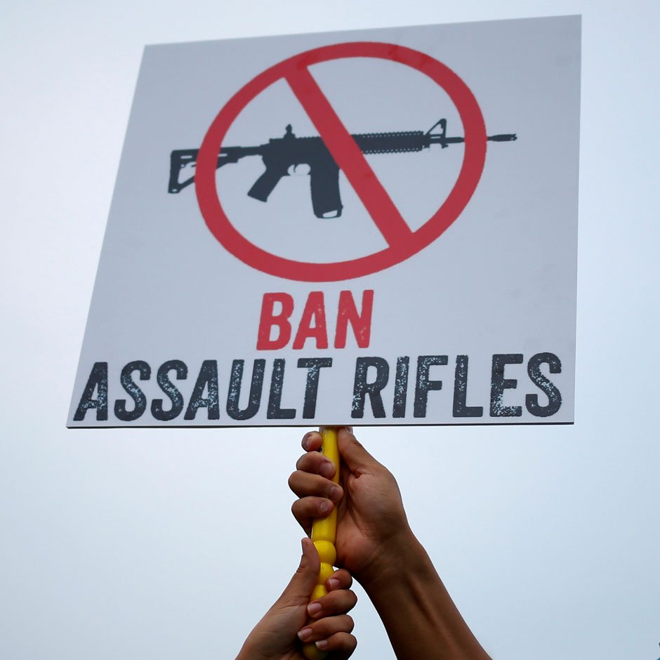 well wishers pose for photos with a sign ahead of a candle light vigil in memory of victims one day after a mass shooting at the pulse gay night club in orlando florida us june 13 2016 photo reuters adrees latif