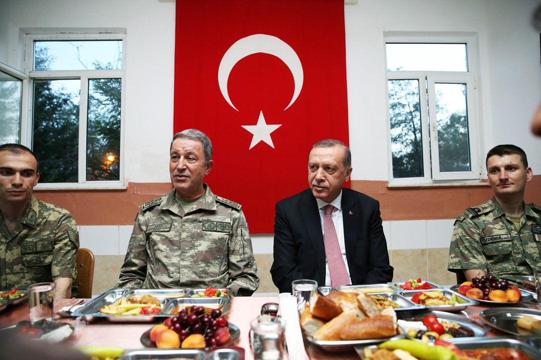 in this photo released by the turkish presidential press office turkish president recep tayyip erdogan sits with soldiers as he breaks his fast at an iftar dinner with the 70th mechanized infantry brigade command in mardin turkey on june 14 2016 photo afp