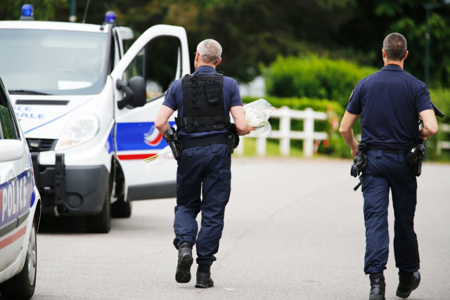 a french policeman bring flowers on june 14 2016 to the house in magnanville where a man claiming allegiance to the islamic state group killed a french policeman and his partner on the night of june 13 photo afp a french policeman bring flowers on june 14 2016 to the house in magnanville where a man claiming allegiance to the islamic state group killed a french policeman and his partner on the night of june 13 photo afp