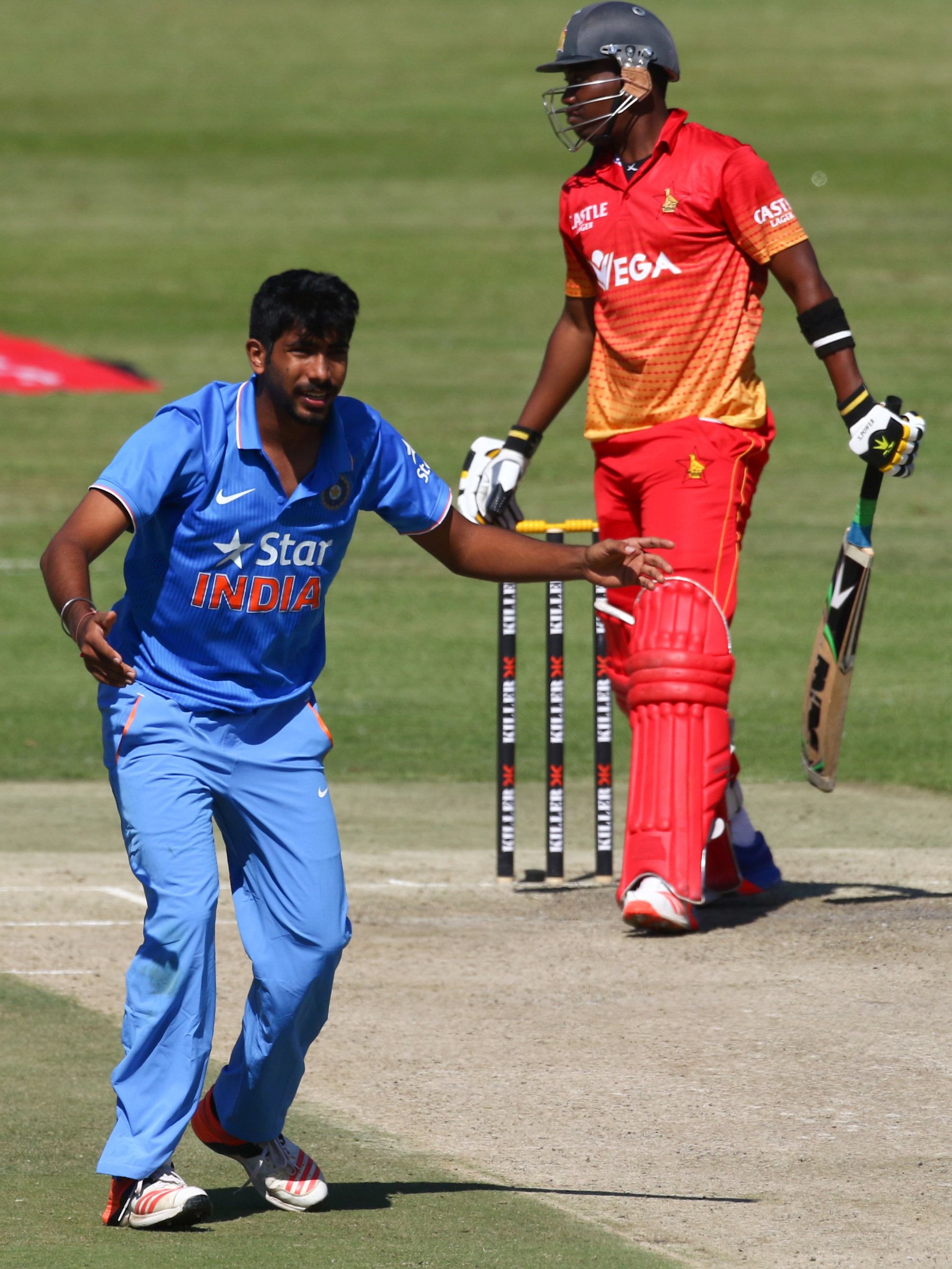 india bowler jasprit bhumra l reacts as zimbabwe batsman neville madziva looks on during the third and final cricket match between india and zimbabwe in a series of 3 odi games at harare sports club on june 15 2016 photo afp