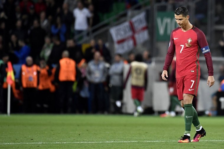 portugal 039 s forward cristiano ronaldo walks on the pitch during the euro 2016 group f football match between portugal and iceland at the geoffroy guichard stadium in saint etienne on june 14 2016 photo afp