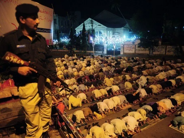 a pakistani policeman stands guard as people perform the special evening prayer quot taraweeh quot on the eve of ramazan photo afp a pakistani policeman stands guard as people perform the special evening prayer quot taraweeh quot on the eve of ramazan photo afp