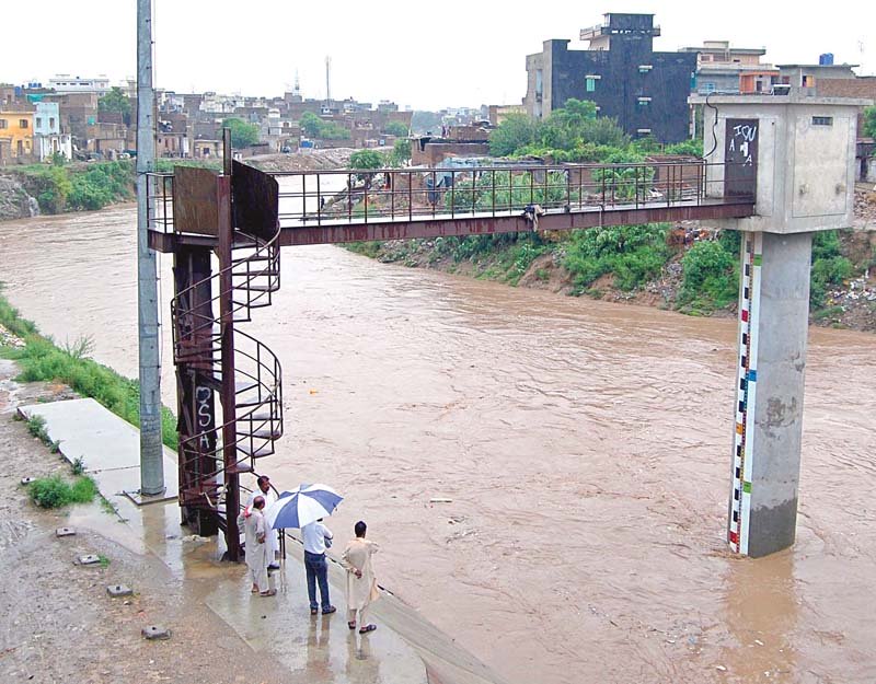 illegal construction around the river regularly leads to loss of life and property in floods photo file