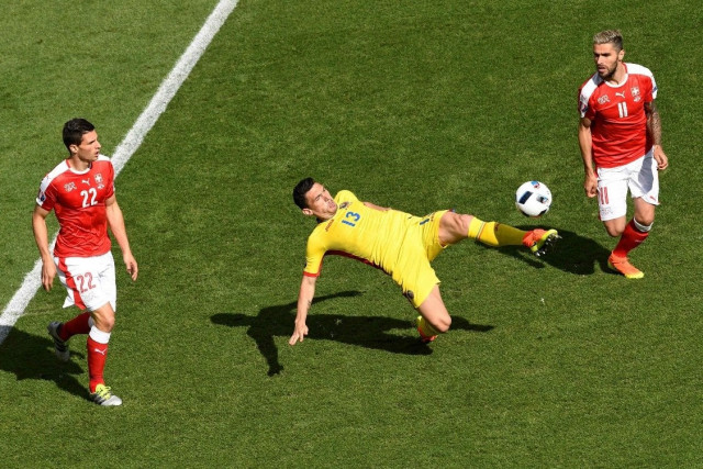 romania 039 s forward florin andone c vies with switzerland 039 s defender fabian schaer l and switzerland 039 s midfielder valon behrami during the euro 2016 group a football match between romania and switzerland at the parc des princes stadium in paris on june 15 2016 photo afp romania 039 s forward florin andone c vies with switzerland 039 s defender fabian schaer l and switzerland 039 s midfielder valon behrami during the euro 2016 group a football match between romania and switzerland at the parc des princes stadium in paris on june 15 2016 photo afp
