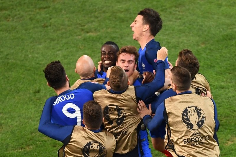 antoine griezmann c is congratulated by teammates after scoring a goal against albania at the velodrome stadium in marseille on june 15 2016 photo afp