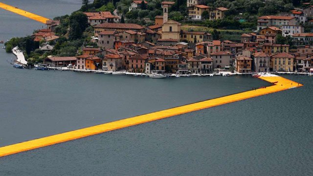 made of 200 000 recyclable polyethylene cubes linked by 200 000 giant screws the piers are covered with a dahlia yellow fabric designed to change tone as the sun sets photo reuter