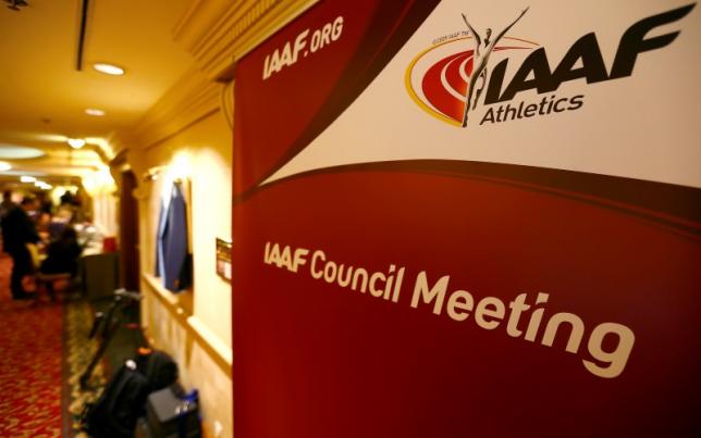 journalists are seen near a logo of the international association of athletics federations iaaf at a hotel where the iaaf council holds a meeting in vienna austria june 17 2016 photo reuters