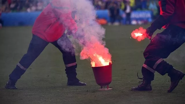 at least 10 flares were lobbed from the croatian corner of the saint etienne stadium in the 86th minute photo afp at least 10 flares were lobbed from the croatian corner of the saint etienne stadium in the 86th minute photo afp