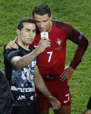 a fan takes a selfie with cristiano ronaldo at the end of the game photo reuters a fan takes a selfie with cristiano ronaldo at the end of the game photo reuters