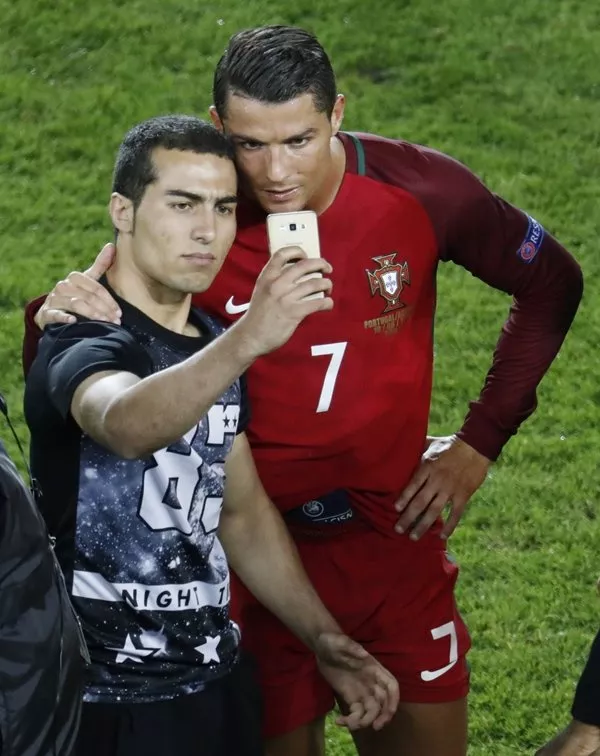 a fan takes a selfie with cristiano ronaldo at the end of the game photo reuters a fan takes a selfie with cristiano ronaldo at the end of the game photo reuters