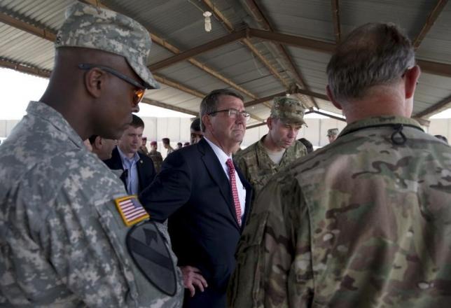 file photo of us defence secretary ash carter standing with col otto liller commander 1st special forces group airborne 2nd r as he observes iraqi counter terrorism service forces participate in a training exercise at the iraqi counter terrorism service academy on the baghdad airport complex in baghdad iraq july 23 2015 photo reuters