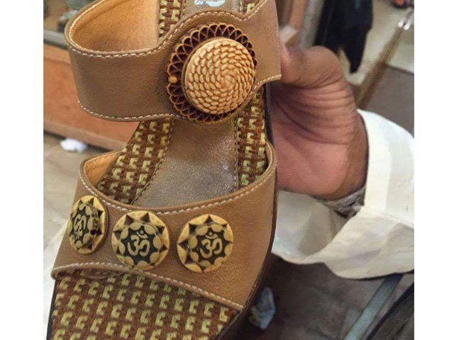 picture shows the sandal which is being sold at shops in tando adam inscribed with hindu sacred word quot om quot photo pakistan hindu council