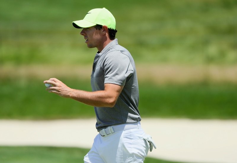 rory mcilroy reacts after putting on the eighth hole during the continuation of the second round of the us open at oakmont country club on june 18 2016 in oakmont pennsylvania photo afp